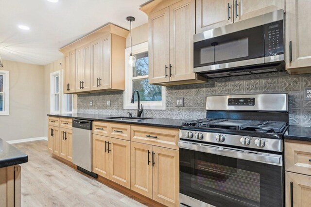 530 Thompson Ave, Winthrop Harbor, IL 60096 - kitchen featuring a sink, stainless steel appliances, and light brown cabinets