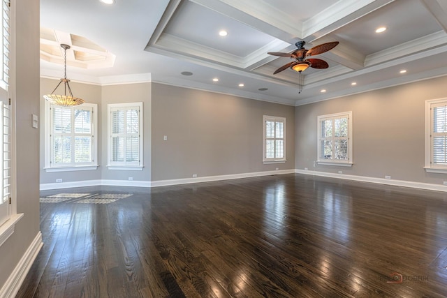 empty room featuring dark wood-style floors, ceiling fan, coffered ceiling, and crown molding