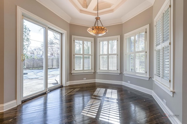unfurnished dining area featuring dark wood-type flooring, visible vents, baseboards, and a healthy amount of sunlight