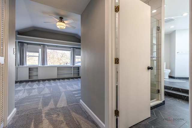 hallway featuring visible vents, carpet floors, baseboards, recessed lighting, and vaulted ceiling
