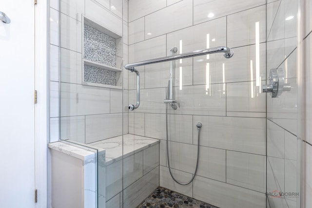bathroom featuring a shower stall