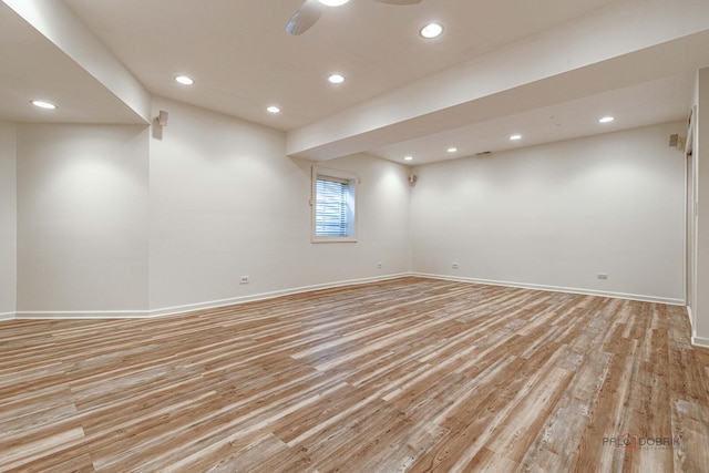 unfurnished room featuring recessed lighting, light wood-style flooring, and baseboards