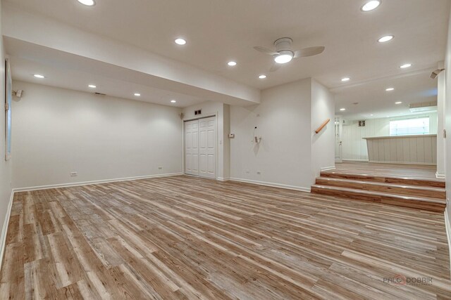 interior space with light wood-style floors, recessed lighting, baseboards, and stairs
