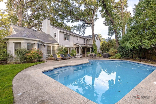 view of pool with a patio and a fenced in pool