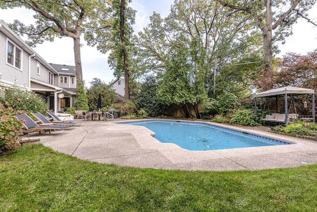 pool with a patio and a gazebo