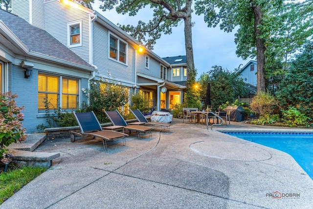 outdoor pool featuring a patio