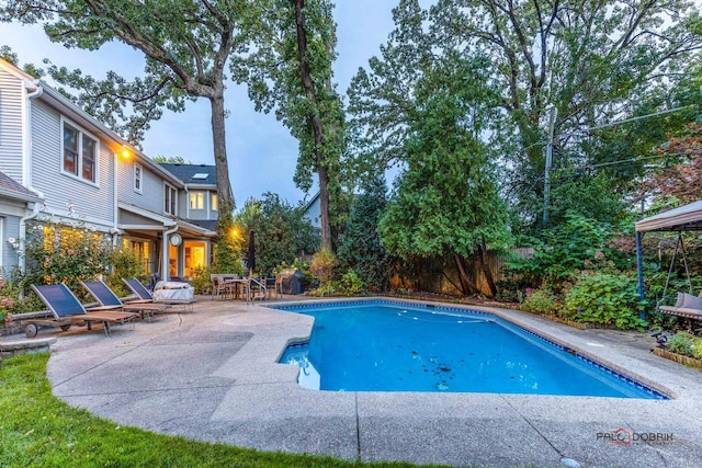 outdoor pool featuring a patio area