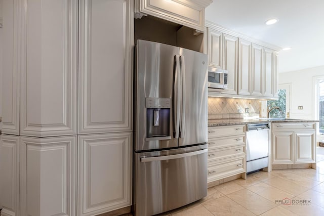 kitchen featuring light tile patterned floors, decorative backsplash, stainless steel appliances, light stone countertops, and recessed lighting