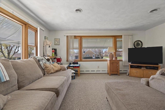 living area with baseboard heating, visible vents, and light carpet