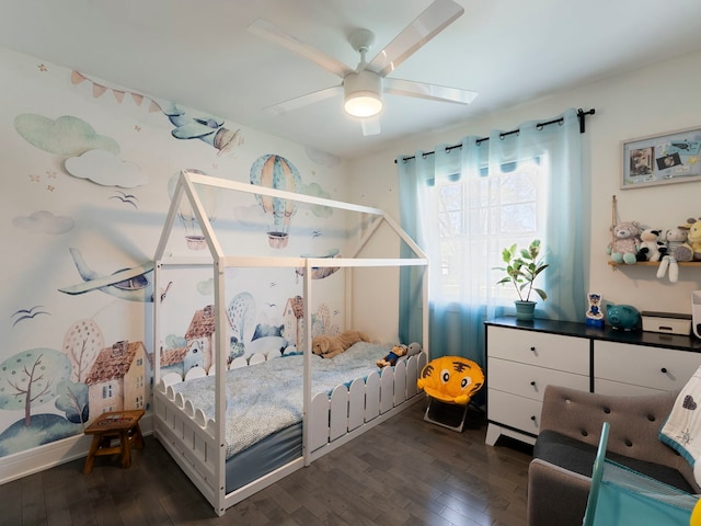 bedroom with ceiling fan and wood finished floors