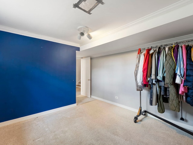 unfurnished bedroom with carpet floors, ornamental molding, baseboards, and a ceiling fan
