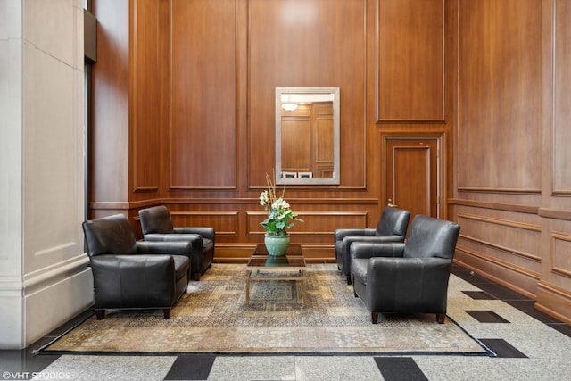 lobby with a decorative wall and a towering ceiling