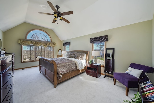 bedroom featuring light colored carpet, a ceiling fan, vaulted ceiling, and baseboards