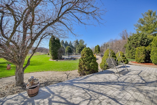 surrounding community with a lawn and a patio area