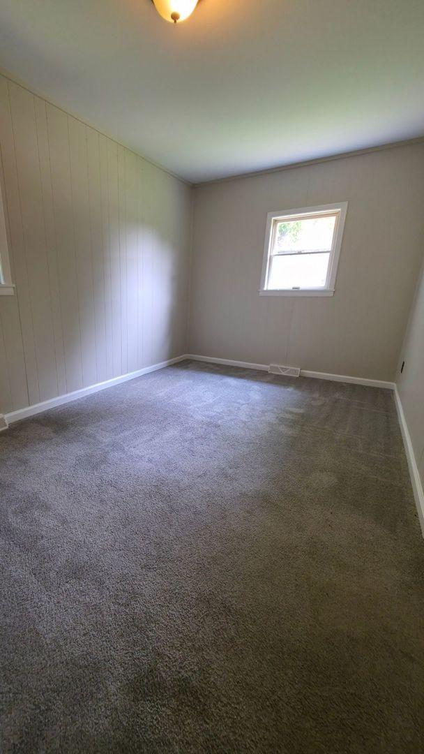 618 Princeton Rd, Depue, IL 61322 - carpeted empty room featuring baseboards