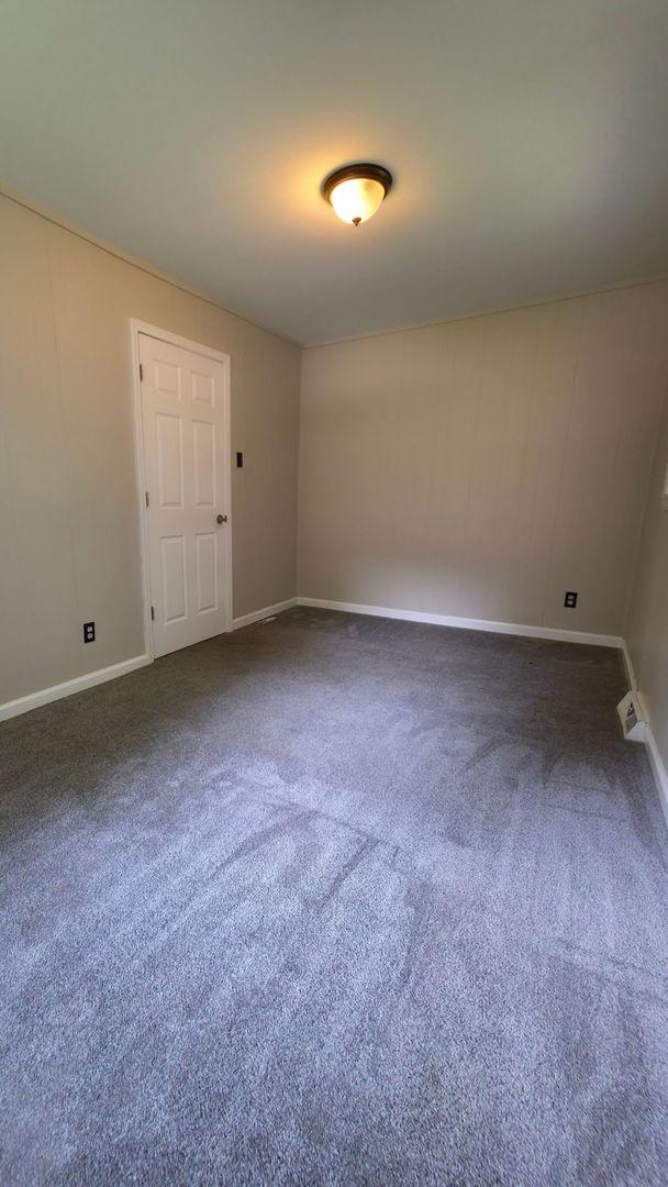 618 Princeton Rd, Depue, IL 61322 - carpeted spare room featuring baseboards
