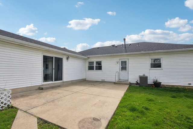 back of house with a yard, cooling unit, and a patio area