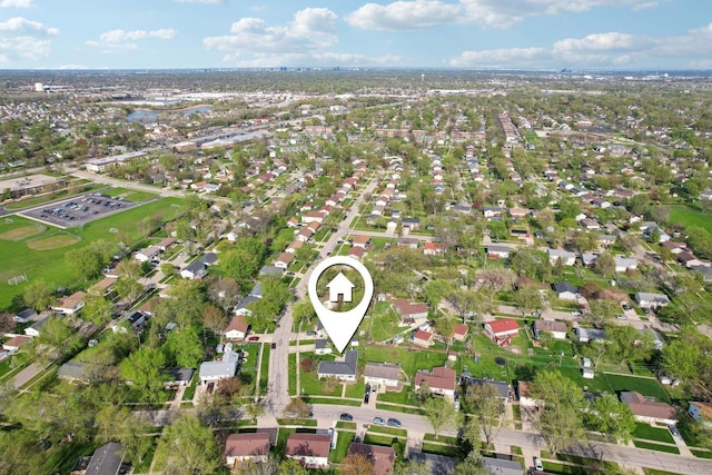 birds eye view of property with a residential view