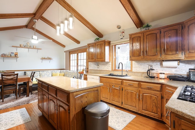 8360 W 100th Pl, Palos Hills, IL 60465 - kitchen with a kitchen island, vaulted ceiling with beams, a sink, and light wood-style floors