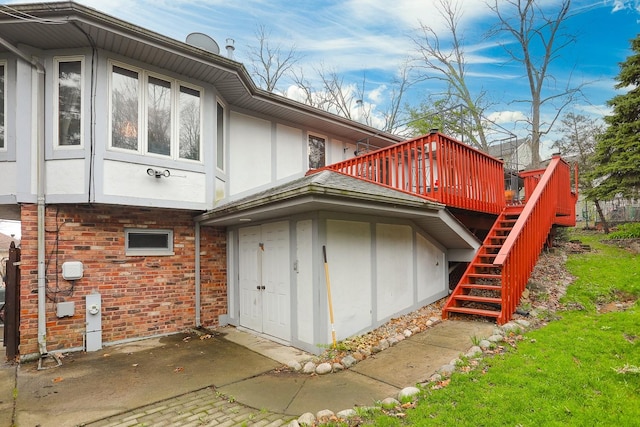 8360 W 100th Pl, Palos Hills, IL 60465 - rear view of property with a wooden deck, brick siding, a patio, stairs, and stucco siding