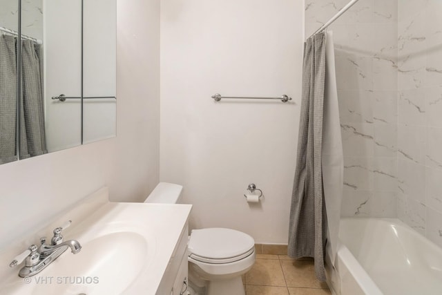 246 George St Unit C, Bensenville, IL 60106 - bathroom with shower / bath combo, vanity, tile patterned floors, baseboards, and toilet