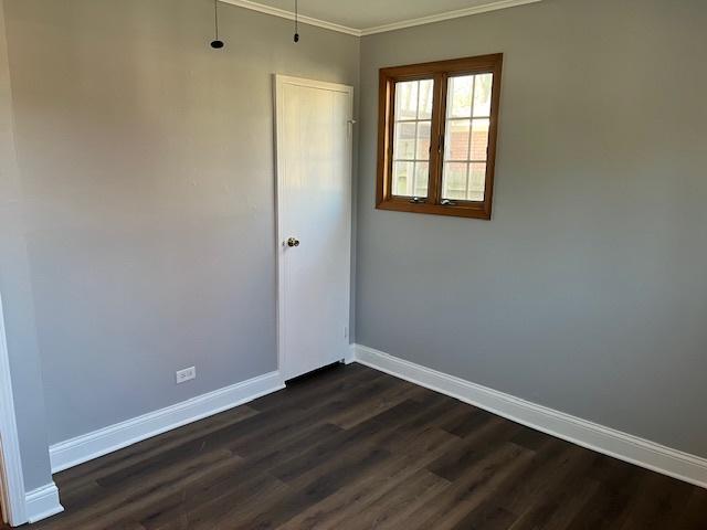 330 Oakwood St, Park Forest, IL 60466 - spare room with ornamental molding, dark wood-style floors, and baseboards
