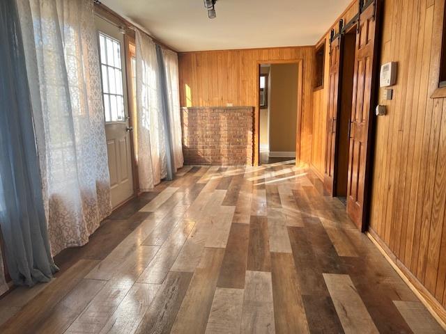 330 Oakwood St, Park Forest, IL 60466 - hallway with wood walls and wood finished floors