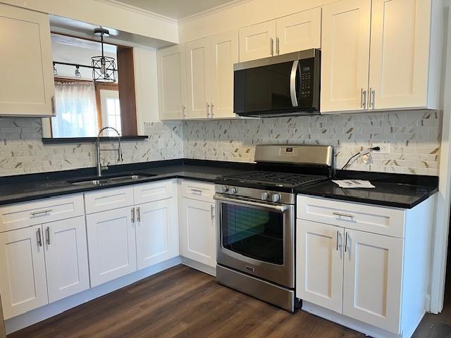 330 Oakwood St, Park Forest, IL 60466 - kitchen with appliances with stainless steel finishes, crown molding, white cabinets, and a sink
