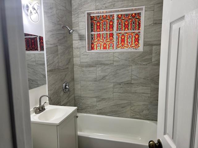 330 Oakwood St, Park Forest, IL 60466 - bathroom with shower / bathing tub combination and vanity