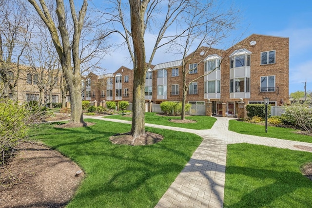 view of community featuring a yard