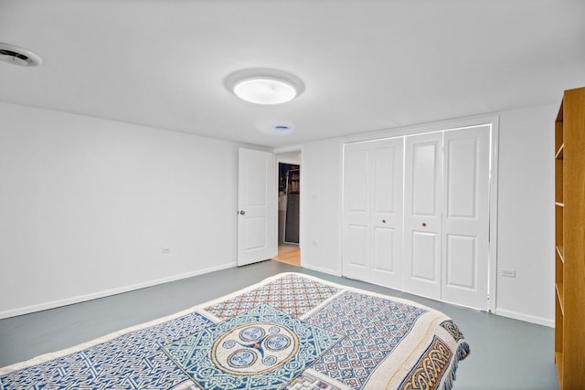 bedroom featuring a closet and baseboards