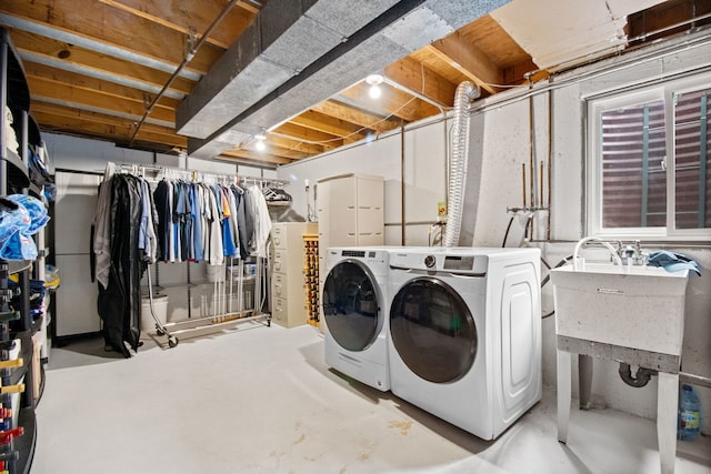 clothes washing area with washer and dryer