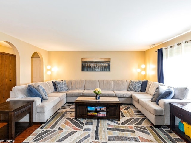 15720 Deerfield Ct Unit 2N, Orland Park, IL 60462 - living room featuring arched walkways and wood finished floors