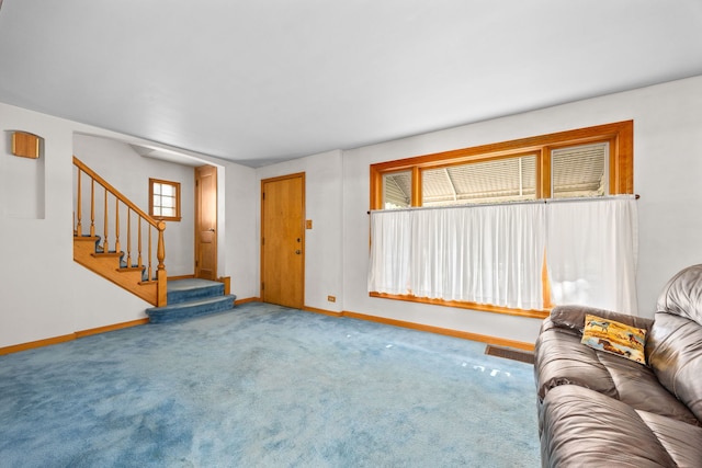 2500 S 7th Ave, North Riverside, IL 60546 - unfurnished living room with baseboards, stairs, and carpet floors