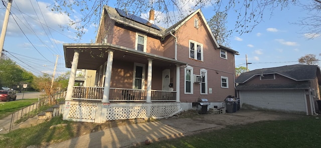 475 Laurel St, Elgin, IL 60120 - view of front of property featuring a porch, solar panels, a garage, driveway, and a chimney