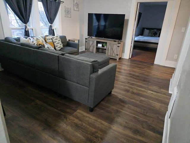 475 Laurel St, Elgin, IL 60120 - living room featuring dark wood-type flooring and baseboards
