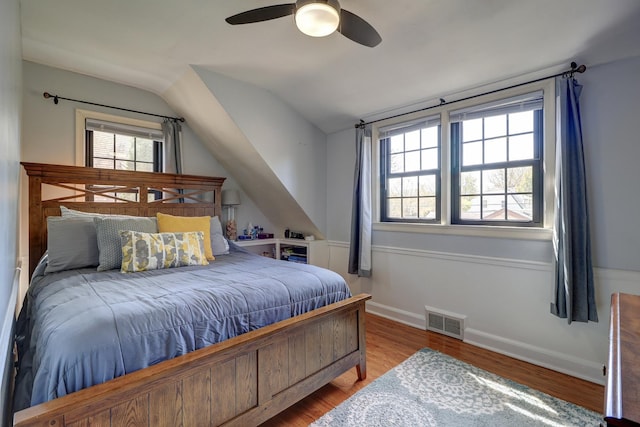 403 W 13th St, Sterling, IL 61081 - bedroom with ceiling fan, lofted ceiling, visible vents, baseboards, and wood finished floors