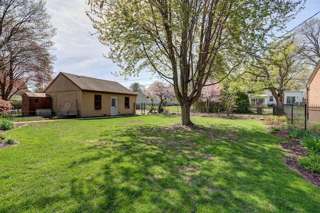 403 W 13th St, Sterling, IL 61081 - view of yard with an outbuilding and a fenced backyard
