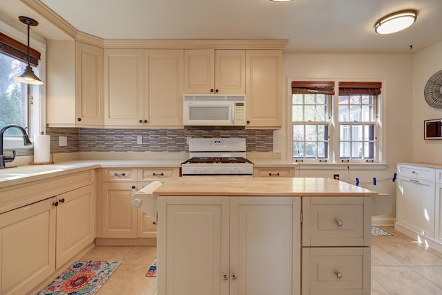 403 W 13th St, Sterling, IL 61081 - kitchen with tasteful backsplash, white appliances, light tile patterned flooring, and a sink