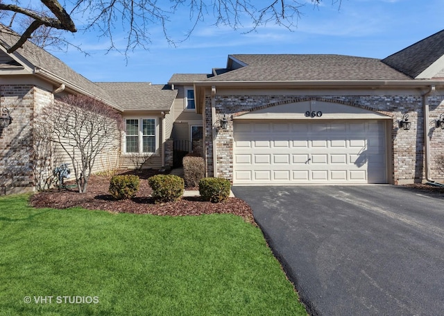 960 Heathrow Ln, Naperville, IL 60540 - view of front facade featuring driveway, a shingled roof, an attached garage, brick siding, and a front lawn