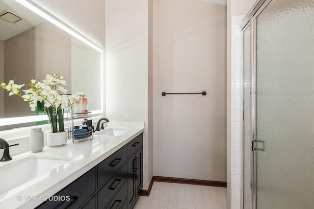 960 Heathrow Ln, Naperville, IL 60540 - bathroom featuring double vanity, a sink, a shower stall, and baseboards
