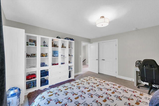 2102 Slade Ln E, Mahomet, IL 61853 - bedroom with carpet floors, baseboards, and a closet