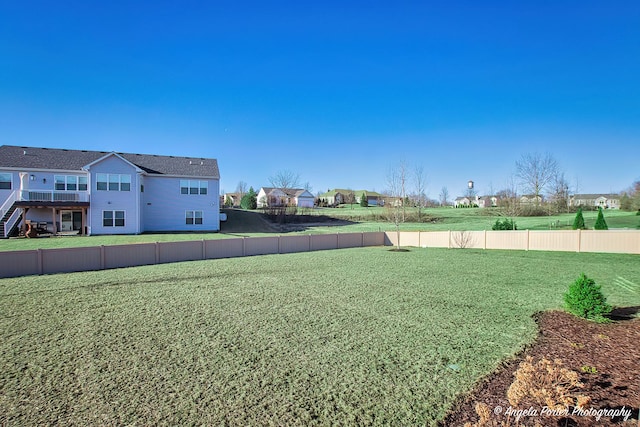view of yard with a residential view and a fenced backyard