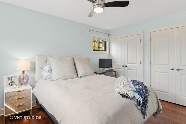 bedroom with multiple closets, wood finished floors, and ceiling fan