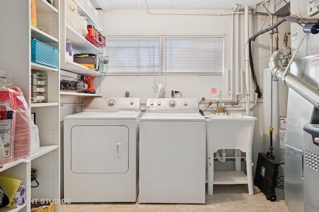 clothes washing area with independent washer and dryer