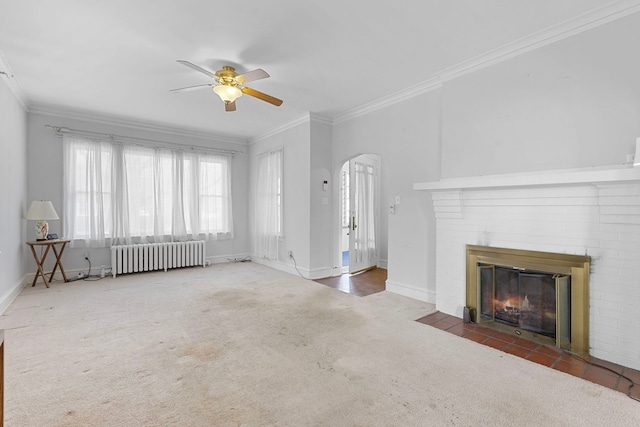 825 Saint John St, Elgin, IL 60120 - unfurnished living room featuring arched walkways, carpet floors, radiator, ceiling fan, and crown molding