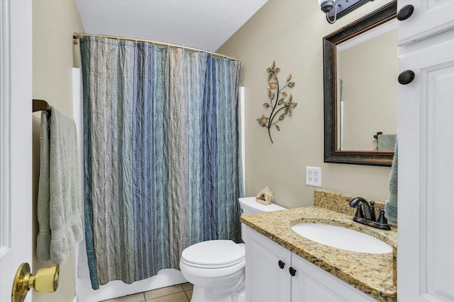bathroom with vanity, tile patterned floors, toilet, and curtained shower