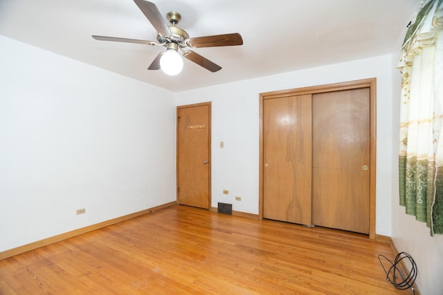 17246 Bernadine St, Lansing, IL 60438 - unfurnished bedroom with a closet, a ceiling fan, light wood finished floors, and baseboards