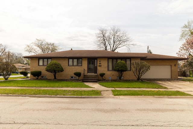17246 Bernadine St, Lansing, IL 60438 - single story home featuring concrete driveway, a front lawn, an attached garage, and brick siding