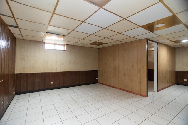 17246 Bernadine St, Lansing, IL 60438 - empty room with wooden walls, a paneled ceiling, and light floors